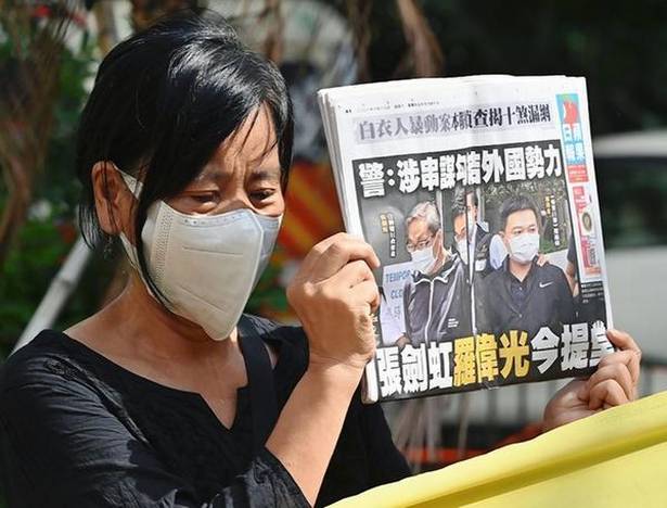 Apple Daily: Hong Kong's pro-democracy newspaper forced to ...